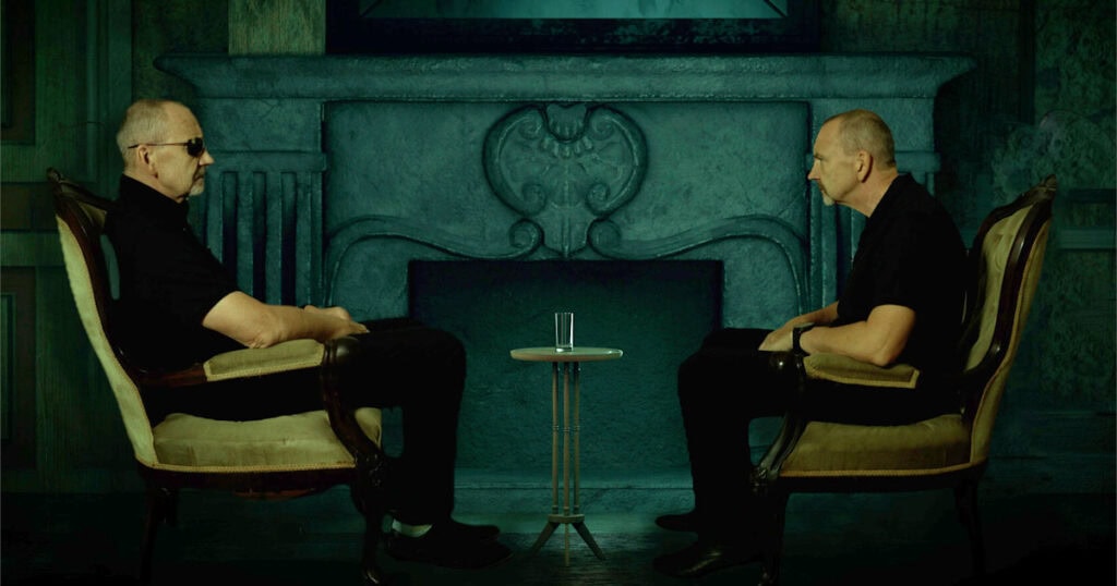 blog_still_2_wide.jpg (2 Dougs facing each other on chairs)