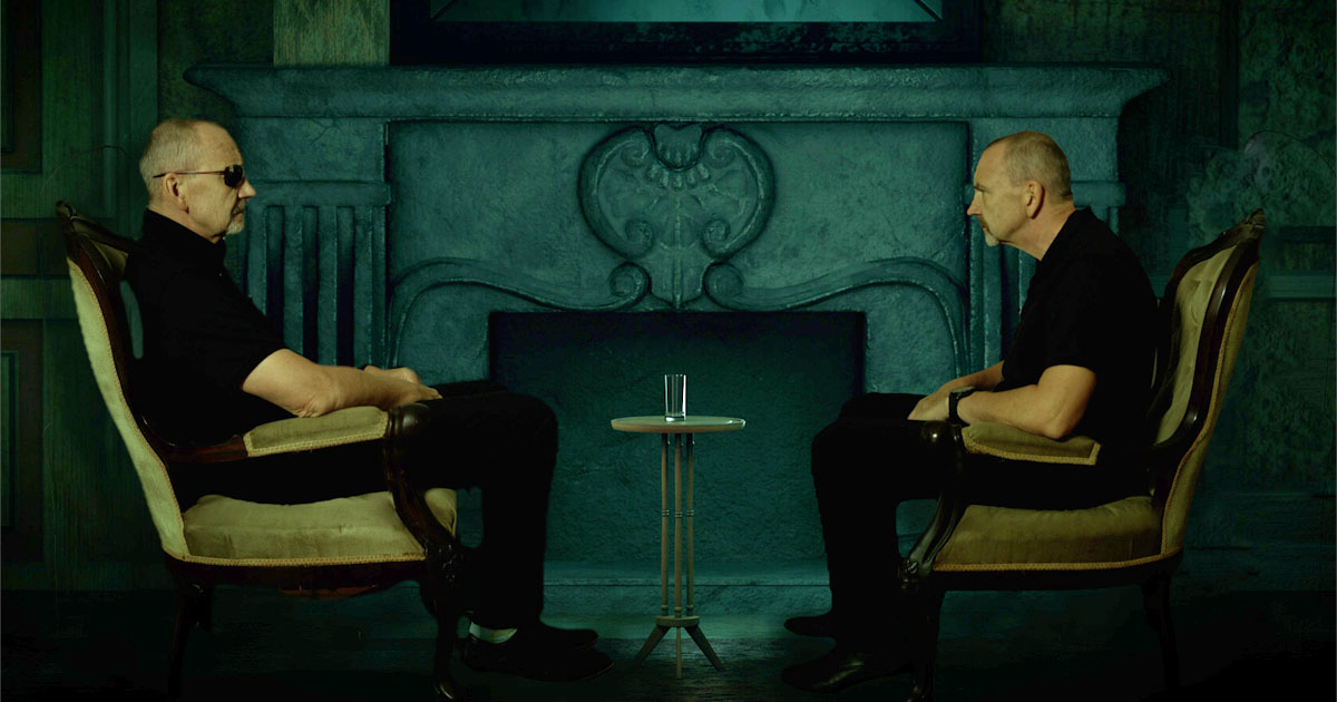 2 Dougs facing each other on chairs